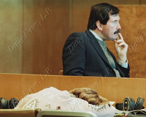 Police Detective John Bonaiuto testifies in the 'Fatal Attraction" trial of Carolyn Warmus as Warmus rest her head on table.